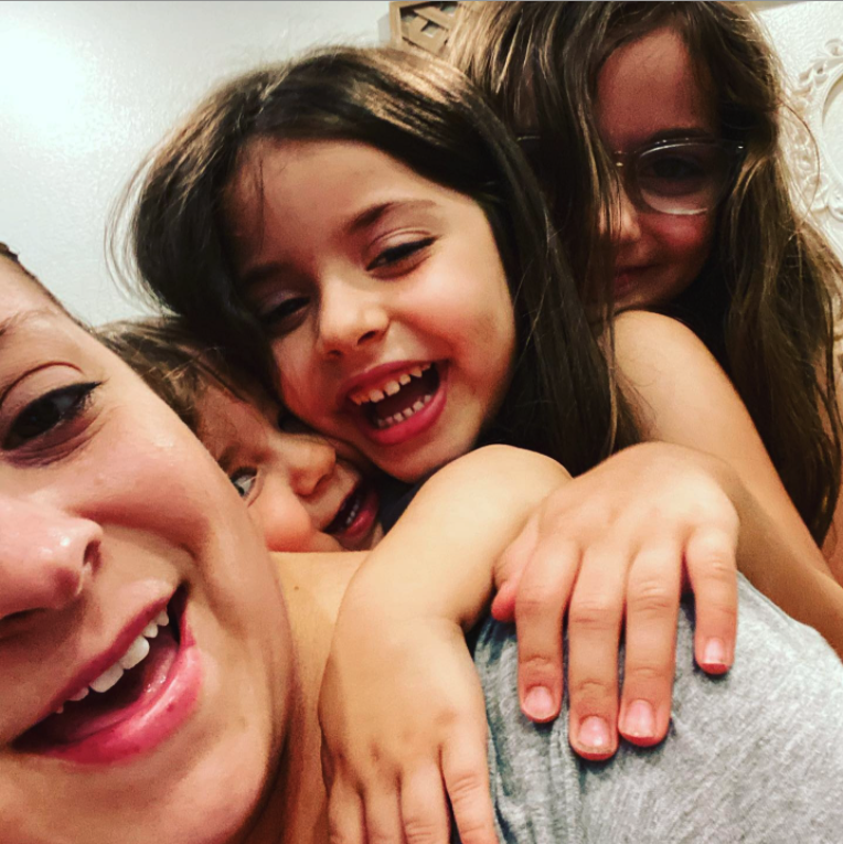 Kristin and her three children.